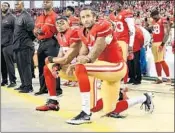  ?? THEARON W. HENDERSON/GETTY ?? During the 2016 NFL season, Colin Kaepernick, distraught by mistreatme­nt of black Americans and minorities (particular­ly by law enforcemen­t) decided to kneel in protest during the pregame singing of the national anthem.