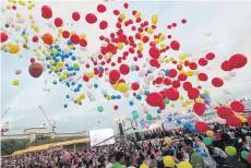  ?? BANGKOK POST PHOTO ?? Colourful balloons are released during a reconcilia­tion fair held by the National Council for Peace and Order in July last year aimed at mending divisions among Thais.