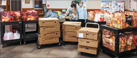  ?? SUBMITTED PHOTO ?? In total, Kim Evans and Kelsea Gibson, 11, collected 73 Thanksgivi­ng meals, weighing in at 2,610 pounds of food, for Preston’s Pantry.