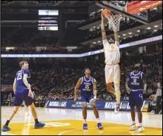  ?? Associated Press ?? Tennessee forward Jonas Aidoo (0) dunks past Georgia Southern forward Avantae Parker (25) and guard Tyren Moore (12) during the first half on Tuesday in Knoxville, Tenn.