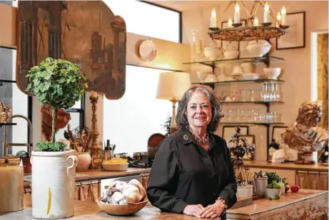  ?? Steve Gonzales photos / Houston Chronicle ?? Donna Brown has filled her home above her antiques store, The Gray Door, with unique pieces, each with a story or experience attached.