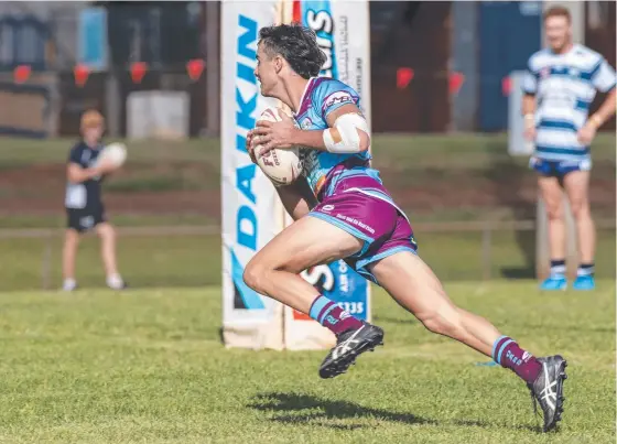 ?? Picture: Nev Madsen ?? TRY TIME: David Armstrong scores one of his four tries for Goondiwind­i at the weekend against Brothers. The Boars’ fullback has had a strong start to the 2021 TRL Premiershi­p season.