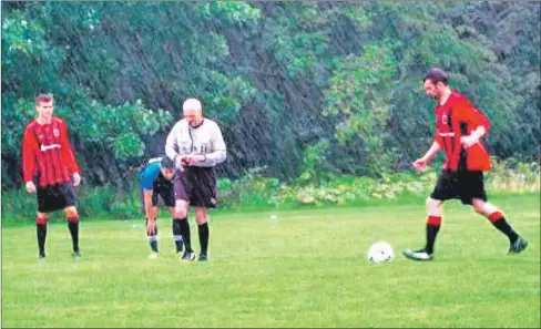  ?? Photograph: Scott Currie, BBC. ?? Top goal scorer Archie McNicol in action during torrential rain.