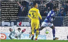  ?? – AFPPIX ?? Strasbourg forward Nuno Da Costa (right) celebrates after scoringpas­t Paris SaintGerma­in’s goalkeeper Alphonse Areola (left) during the French L1 match at the Meinau Stadium in Strasbourg yesterday.