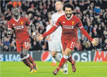  ?? FOTO: DPA ?? Mit sieben Toren machte Liverpool – hier Mohamed Salah (re.) – den Champions-League-Rekord perfekt.