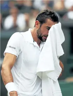  ?? DANIEL LEAL-OLIVA/GETTY IMAGES ?? Marin Cilic reacts during the Gentlemen’s Singles final against Roger Federer on Day 13 of the Wimbledon Lawn Tennis Championsh­ips at the All England Lawn Tennis and Croquet Club at Wimbledon on Sunday, in London, England.