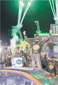  ?? TERRY RENNA/ASSOCIATED PRESS ?? Martin Truex Jr. celebrates in Victory Lane after winning the NASCAR Cup Series championsh­ip on Sunday at Homestead-Miami Speedway.