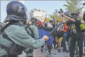  ?? AP/VINCENT YU ?? Protesters clash with police