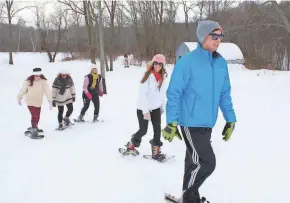  ?? CENTER ?? Snowshoein­g is a fun way to enjoy a Wisconsin winter.