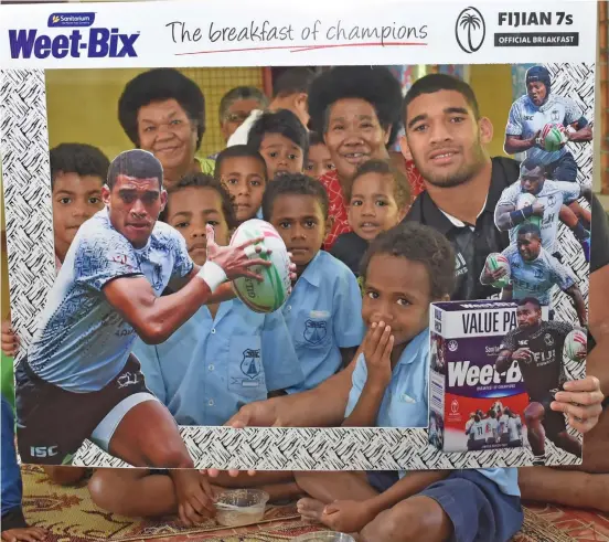  ?? Photo: Nicolette Chambers ?? Fiji Airways Fiji 7s star, Meli Derenalagi with fans of Narewa Village in Nadi during the CJ Patel Weet-Bix promotion on September 19, 2019.