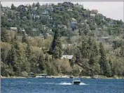  ?? Allen J. Schaben Los Angeles Times ?? HOMES rise above the waters of Lake Arrowhead, in the San Bernardino mountains east of Los Angeles.