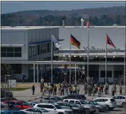  ?? ELIJAH NOUVELAGE — GETTY IMAGES ?? Employees outside the entrance to a Volkswagen automobile assembly plant on Wednesday in Chattanoog­a, Tenn. The United Auto Workers filed for a union vote for hourly workers at the plant.
