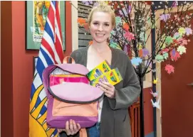  ?? CITIZEN PHOTO BY JAMES DOYLE ?? Alyse Willman shows off some of the items that will given to children in need as part of Help A Superhero.