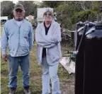  ??  ?? Tim and Linda Lawson stand by the well outside their Ocala home. The Lawsons were told in November that the well is contaminat­ed with possible carcinogen­s.