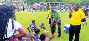  ??  ?? Head coach of Happy Grove, Vincent Wallace, conducting team talk during Saturday’s daCosta Cup against Titchfield High School at Carder Park in Port Antonio.