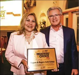 ?? PHOTO VINCENT OSUNA ?? Rogers & Rogers Auto Group owners Les (right) and Terri Rogers pose after receiving the 2019 Imperial Valley Press Legacy Award during the annual Readers’ Choice Gala held Wednesday at the Old Eucalyptus Schoolhous­e in El Centro.