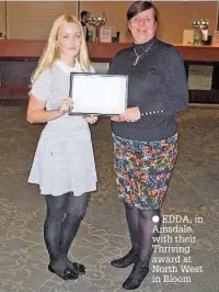  ??  ?? EDDA, in Ainsdale, with their Thriving award at North West in Bloom