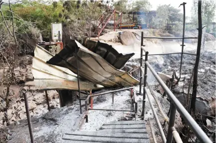  ??  ?? Burned barracks inside the Kangaba tourist resort in Bamako on Tuesday, a day after suspected militants stormed the resort, briefly seizing more than 30 hostages and leaving at least two people dead. (AFP)