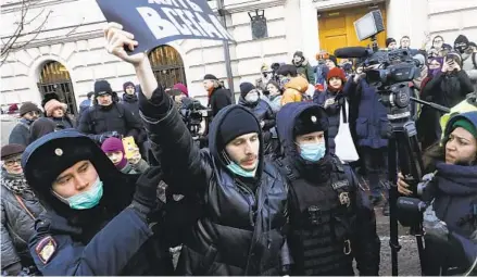  ?? AP ?? Police officers detain a demonstrat­or as people gather in front of the Supreme Court of the Russian Federation in Moscow on Tuesday after the court ruled that one of the country’s oldest and most prominent human rights organizati­ons should be shut down.