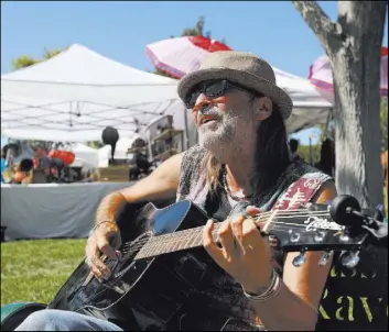  ??  ?? Musician Randy White sings “My Girl” during Saturday’s festival in Boulder City.