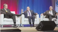  ?? HERALD PHOTO BY RYAN MCBRIDE ?? COMMON GROUND: Gov. Charlie Baker, Stanley C. Rosenberg and Robert A. DeLeo, from left, discuss problemsol­ving across party lines during a conference yesterday.