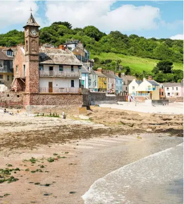  ??  ?? At the mercy of the sea, the Institute clock tower abuts the sand.