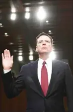  ?? BRENDAN SMIALOWSKI/AFP ?? Former FBI Director James Comey takes the oath before he testifies during a US Senate Select Committee on Intelligen­ce hearing on Capitol Hill in Washington, DC, yesterday.
