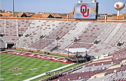  ?? [CHRIS LANDSBERGE­R/ THE OKLAHOMAN] ?? ESPN “College GameDay” crews work to set up the set at Gaylord Family-Oklahoma Memorial Stadium on Friday ahead of Bedlam.