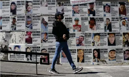  ?? ?? Posters with the portraits of disappeare­d people cover a wall in Guadalajar­a, Jalisco, Mexico. Photograph: Francisco Guasco/EPA