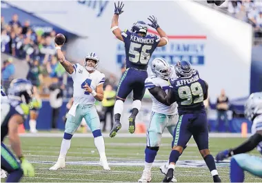  ?? JOHN FROSCHAUER/ASSOCIATED PRESS ?? Dak Prescott (4), shown passing last week at Seattle, leads the Cowboys into a game today against Detroit. Both teams are 1-2, but the Lions are feeling good after coming off a dominant win over New England.