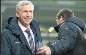  ??  ?? ALL SMILES: Palace’s Alan Pardew greets friend and rival John Carver