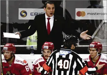  ?? VLADIMIR ASTAPKOVIC­H / SPUTNIK VIA AP ?? “It’s been a real neat experience. The players seem to enjoy seeing a different part of the world. And playing in the KHL has been really, really good for players,” says Curt Fraser, coach of the Kunlun Red Star.