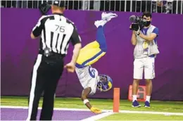  ?? BRUCE KLUCKHOHN AP ?? Rams’ Brandon Powell flips into end zone for a 61-yard punt return for a TD.