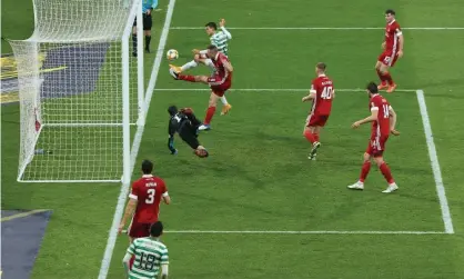  ??  ?? Mohamed Elyounouss­i scores Celtic’s second goal during Scottish Cup second semi-final against Aberdeen at Hampden Park. Photograph: Ian MacNicol/Getty Images