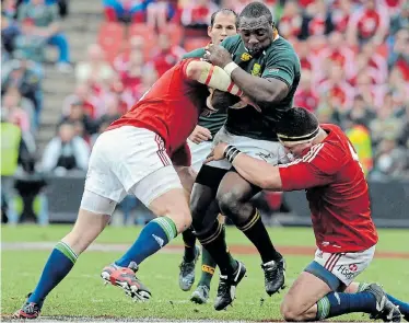  ?? Picture: GALLO IMAGES/LEE WARREN ?? HIGH STAKES: If the Lions’ three-Test match series against the Springboks in SA next year is cancelled due to the coronaviru­s outbreak, the Bay will lose out financiall­y too. Above, the Lions’ Phil Vickery and Andrew Sheridan tackle SA’s Tendai Myawarira during their Test match at Ellis Park Stadium in 2009