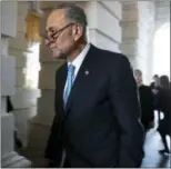  ?? JACQUELYN MARTIN — ASSOCIATED PRESS ?? Senate Minority Leader Charles Schumer, D-N.Y., walks into the Capitol building in Washington on Friday after meeting with President Donald Trump.