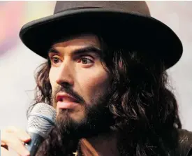  ?? PHOTO BY CAROLINE MCCREDIE/GETTY IMAGES ?? THE BRIT: Russell Brand is a decadent creature, like a louche attendant in a French court.