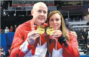  ?? CP PHOTO ?? Skips Kevin Koe and Rachel Homan show off their medals from the Roar of the Rings Olympic Curling Trials in Ottawa on Sunday.