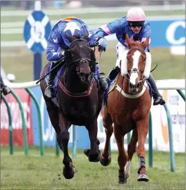  ??  ?? Tom Scudamore, left, guides Mighty Thunder to victory in the Scottish National at Ayr