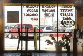  ?? Kim Brent / The Enterprise ?? Chairs are stacked in March inside Dawn Donuts in Beaumont. Restaurant­s are now allowed to open at 25 percent capacity, but some have decided to stay closed.