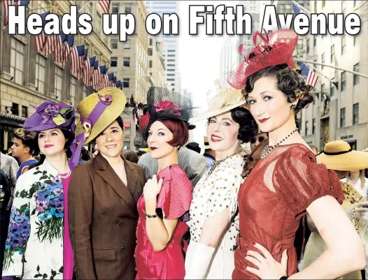  ??  ?? Revelers wear their Sunday best — topped off with extravagan­t chapeaus — at the Easter Parade and Bonnet Festival along Fifth Avenue.