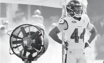  ?? AMY DAVIS/BALTIMORE SUN ?? Ravens cornerback Marlon Humphrey tries to cool off during training camp. He has played with vigor and desire so far in practice.