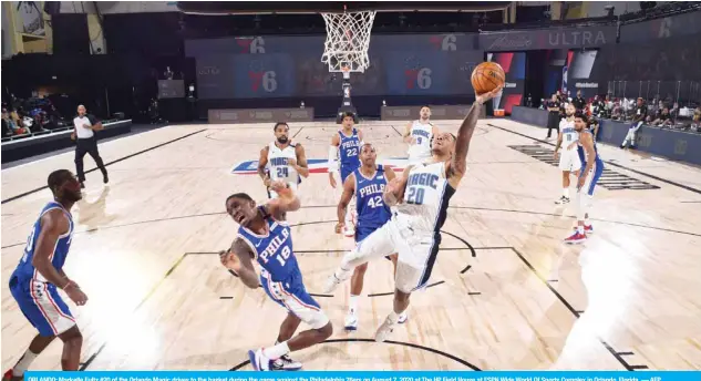  ?? — AFP ?? ORLANDO: Markelle Fultz #20 of the Orlando Magic drives to the basket during the game against the Philadelph­ia 76ers on August 7, 2020 at The HP Field House at ESPN Wide World Of Sports Complex in Orlando, Florida.