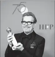  ?? Allen J. Schaben Los Angeles Times ?? GARY OLDMAN accepts his award for “Darkest Hour.” The film has taken in more than $28 million and was No. 8 in the U.S. and Canada last weekend.