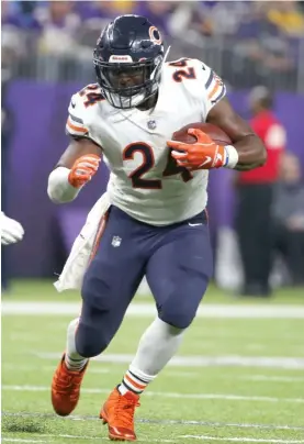  ?? GETTY IMAGES (LEFT), AP ?? In two of the Bears’ signature victories — against the Rams on Dec. 9 and Sunday against the Vikings — Tarik Cohen (left) and Jordan Howard were prominent.