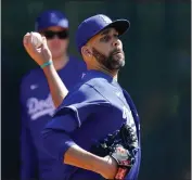  ?? ROSS D. FRANKLIN — THE ASSOCIATED PRESS ?? Dodgers pitcher David Price throws during a spring training workout, hoping he can regain his form this season.