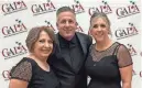  ?? ?? Event hosts Renée Griffith and Lisa Valerio pose with John Sprogis from United Cerebral Palsy of the Inland Empire at the gala.