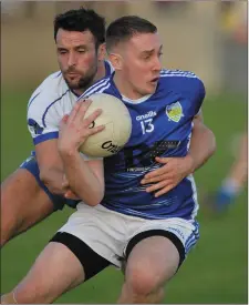  ??  ?? Barry O’Hare of Roche Emmets is challenged by Lannleire’s Laurence McEntee. Picture: Ken Finegan/Newspics