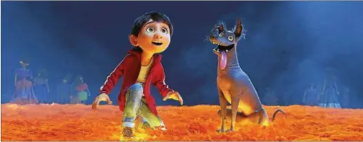  ?? DISNEY-PIXAR ?? Miguel, the young hero of “Coco,” is shown in a scene from the movie with his dog, Dante.