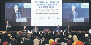  ??  ?? Dr Mahathir said the evolutiona­ry pace in the Islamic banking and finance industry has intensifie­d in recent years where concepts of Islamic finance have been incorporat­ed into many financial products to meet the changing needs of consumers, businesses and investors. — Bernama photo